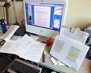 desk covered in research papers