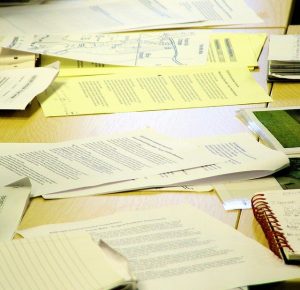 pile of papers on a desk