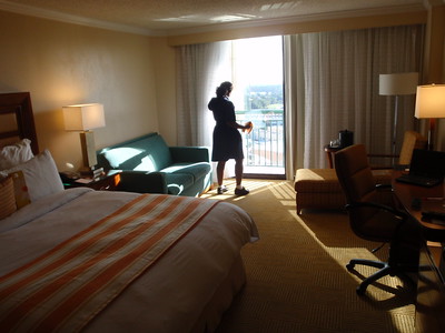 housekeeper cleaning hotel room