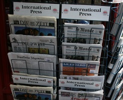 rack of international newspapers