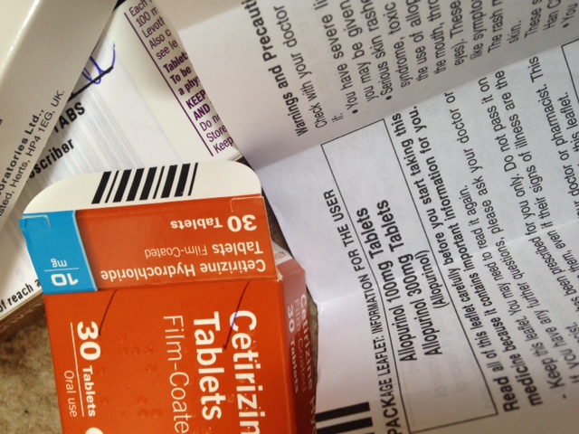 packet of tablets with user instructions opened up alongside