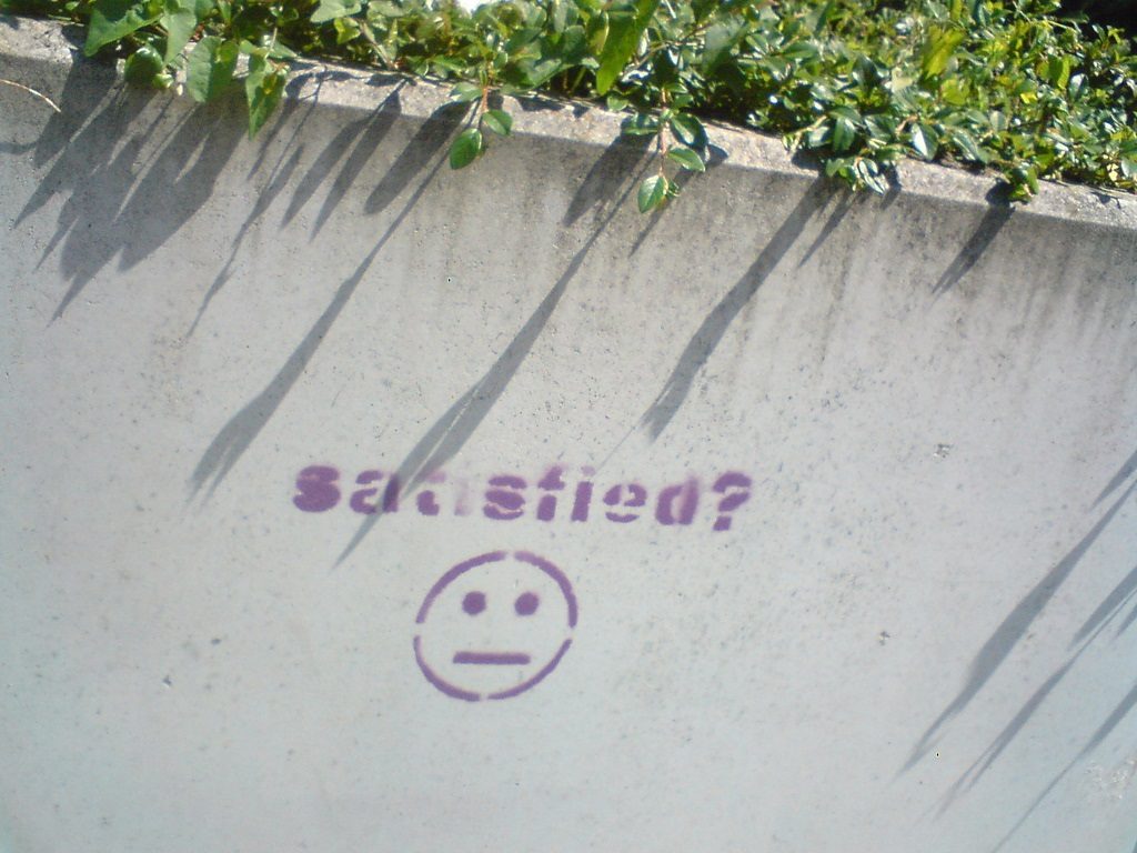 a satisfied emoji painted onto a pavement