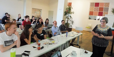 participants listening to Caroline during the survey workshop in Prague