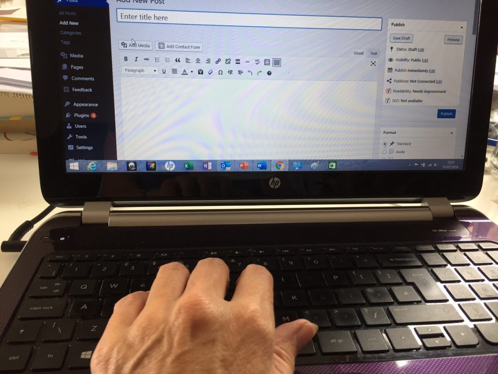 hands writing a blog