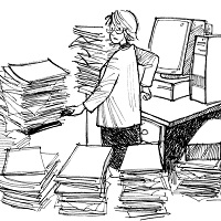 researcher surrounded by piles of paper awaiting her action