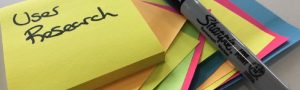 sticky notes with user research written on them